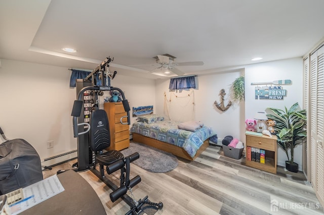 119 Carteret Ave, Carteret, NJ 07008 - bedroom with recessed lighting, wood finished floors, ceiling fan, a baseboard heating unit, and a closet