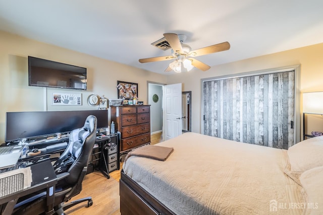 119 Carteret Ave, Carteret, NJ 07008 - bedroom with light wood finished floors, a desk, and ceiling fan