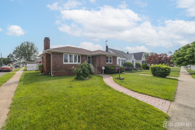 119 Carteret Ave, Carteret, NJ 07008 - view of front facade featuring brick siding, a chimney, and a front yard