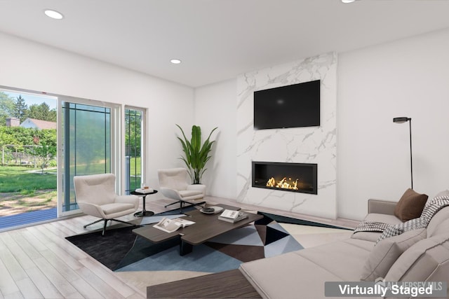 38 Louise Dr, East Brunswick, NJ 08850 - living room featuring a high end fireplace, wood finished floors, and recessed lighting