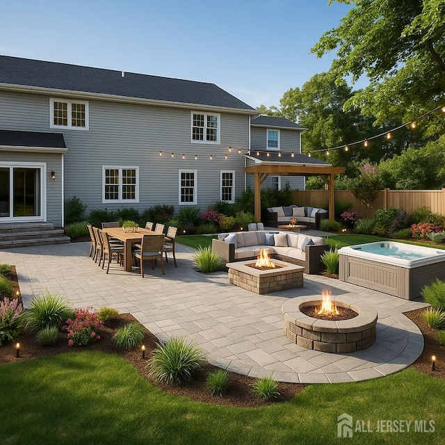 38 Louise Dr, East Brunswick, NJ 08850 - back of property featuring a hot tub, a patio area, an outdoor living space with a fire pit, and entry steps