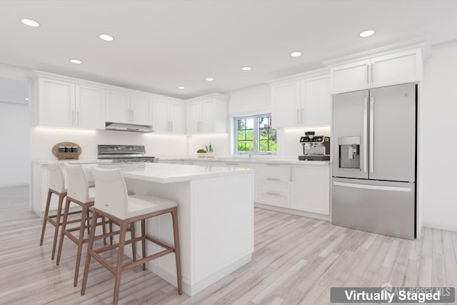 38 Louise Dr, East Brunswick, NJ 08850 - kitchen with stainless steel appliances, under cabinet range hood, white cabinets, and recessed lighting
