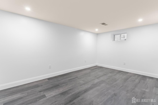 38 Louise Dr, East Brunswick, NJ 08850 - empty room with dark wood-style floors and recessed lighting