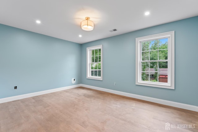 38 Louise Dr, East Brunswick, NJ 08850 - unfurnished room featuring healthy amount of natural light, light wood finished floors, and recessed lighting