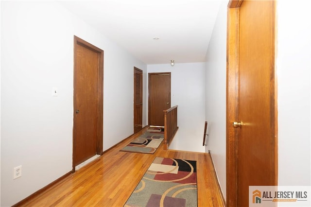 11 Gunpowder Dr, East Brunswick, NJ 08816 - hall featuring light wood finished floors and an upstairs landing