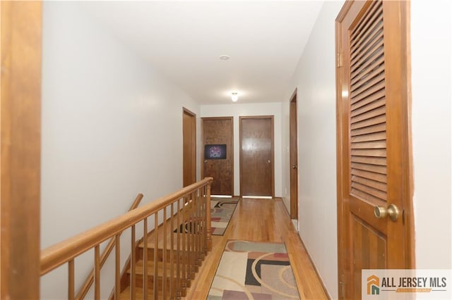 11 Gunpowder Dr, East Brunswick, NJ 08816 - hallway featuring light wood finished floors and an upstairs landing