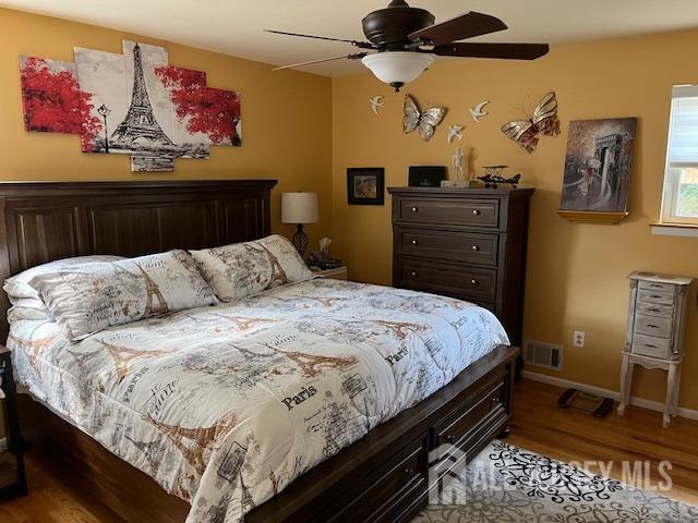 bedroom featuring ceiling fan and light hardwood / wood-style flooring