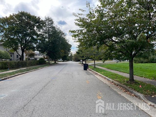 view of road featuring sidewalks and curbs