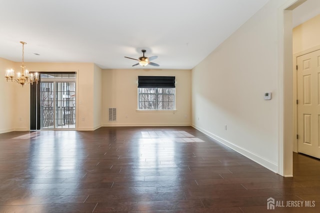 7209 Minuteman Ln, Franklin, NJ 08873 - unfurnished room with plenty of natural light, a chandelier, dark wood-style flooring, and ceiling fan