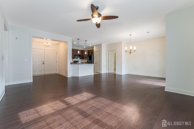 7209 Minuteman Ln, Franklin, NJ 08873 - unfurnished living room with a chandelier, dark wood-style floors, ceiling fan, and baseboards