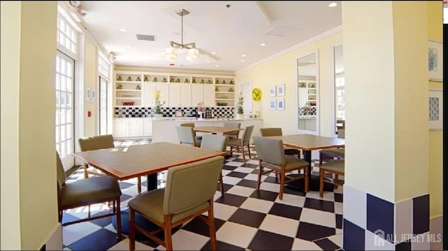 7209 Minuteman Ln, Franklin, NJ 08873 - dining space with healthy amount of natural light, dark flooring, crown molding, and recessed lighting