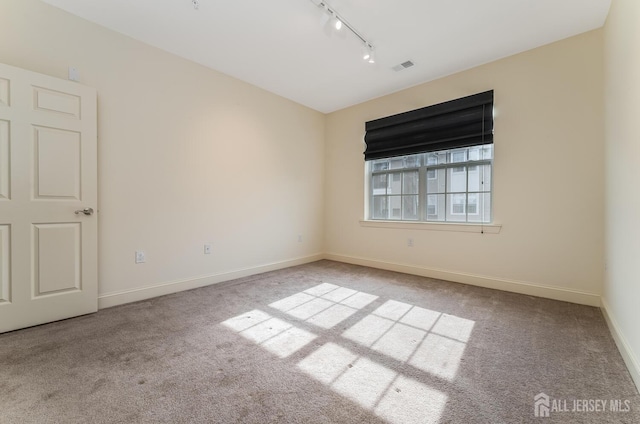 7209 Minuteman Ln, Franklin, NJ 08873 - unfurnished room featuring track lighting, carpet flooring, and baseboards