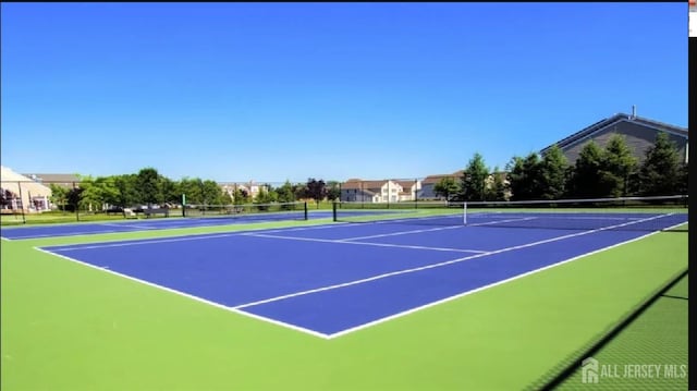 7209 Minuteman Ln, Franklin, NJ 08873 - view of tennis court featuring community basketball court and fence