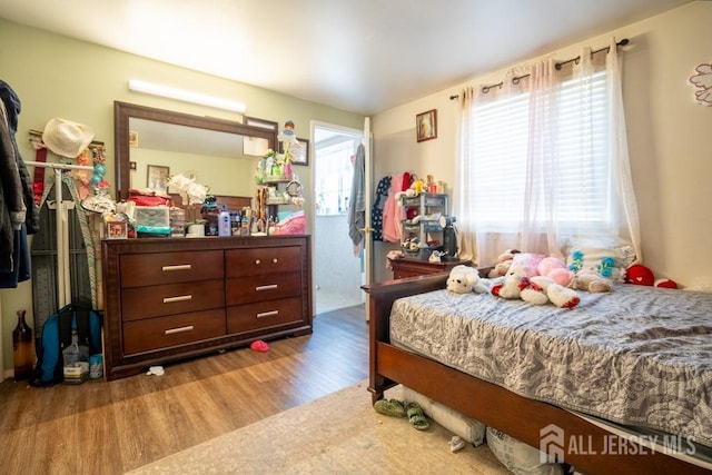 bedroom featuring wood finished floors