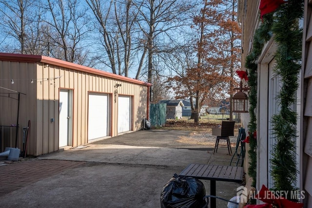 detached garage featuring fence