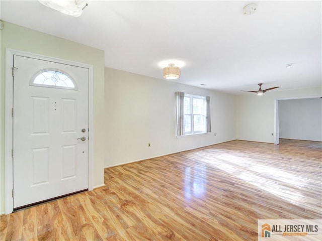 entrance foyer with ceiling fan and light wood-type flooring