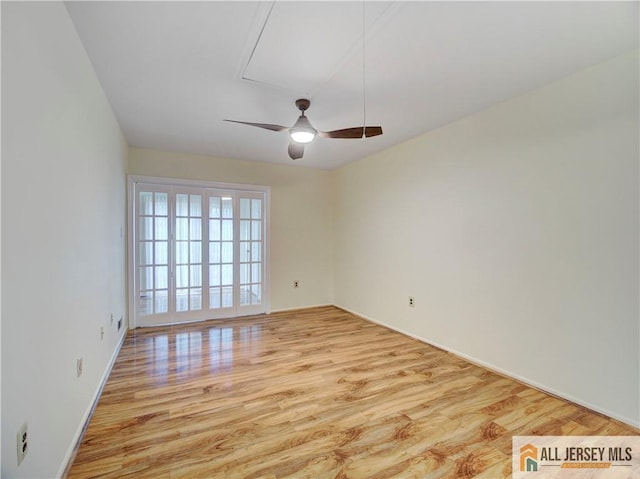 unfurnished room with ceiling fan and light hardwood / wood-style flooring