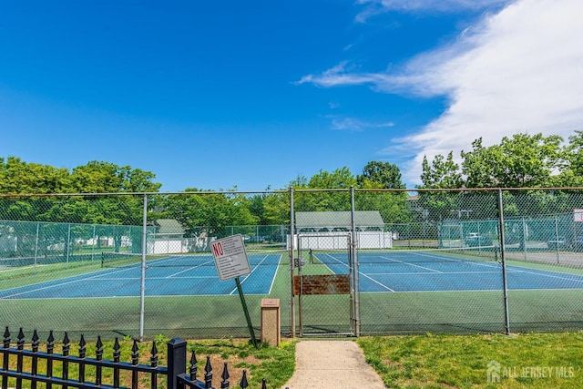 view of sport court with fence