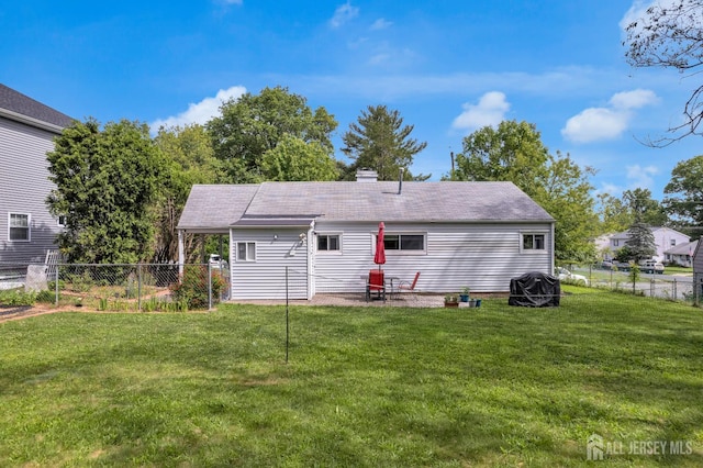 4 Dayton Rd, Edison, NJ 08817 - rear view of house with a chimney, a shingled roof, and a patio