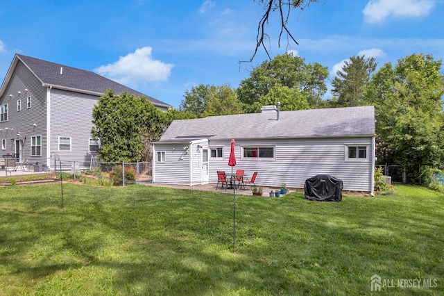 4 Dayton Rd, Edison, NJ 08817 - rear view of house featuring a patio and a shingled roof