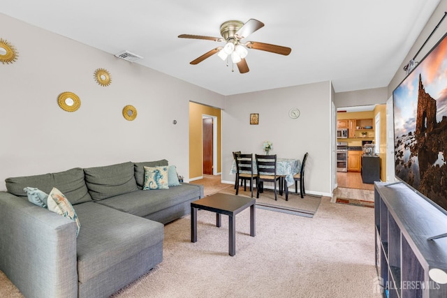 4 Dayton Rd, Edison, NJ 08817 - living room featuring a ceiling fan, light carpet, and baseboards