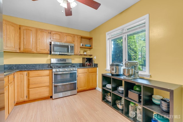 4 Dayton Rd, Edison, NJ 08817 - kitchen with stainless steel appliances, open shelves, ceiling fan, dark countertops, and light wood-style floors