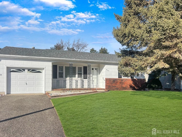 ranch-style house with a garage, covered porch, and a front lawn