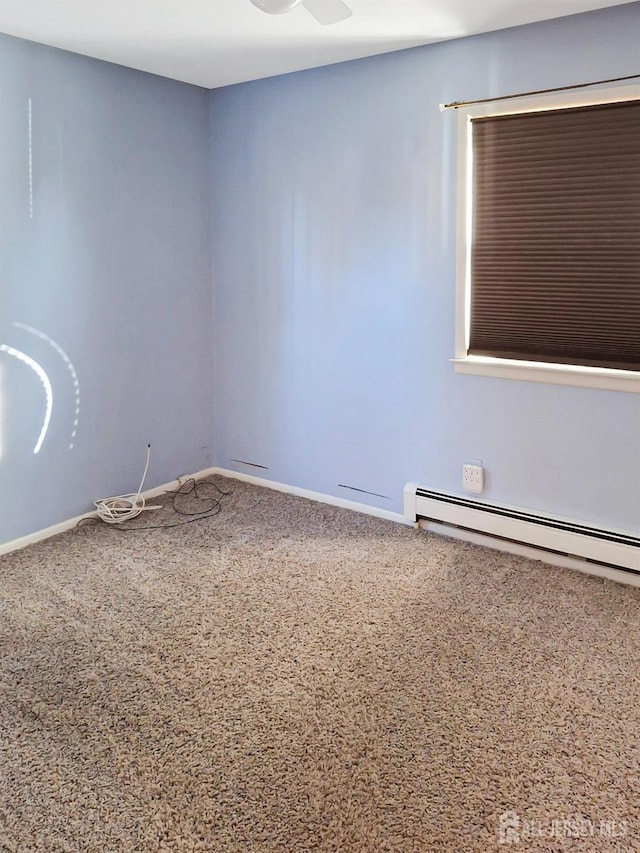 empty room featuring a baseboard radiator