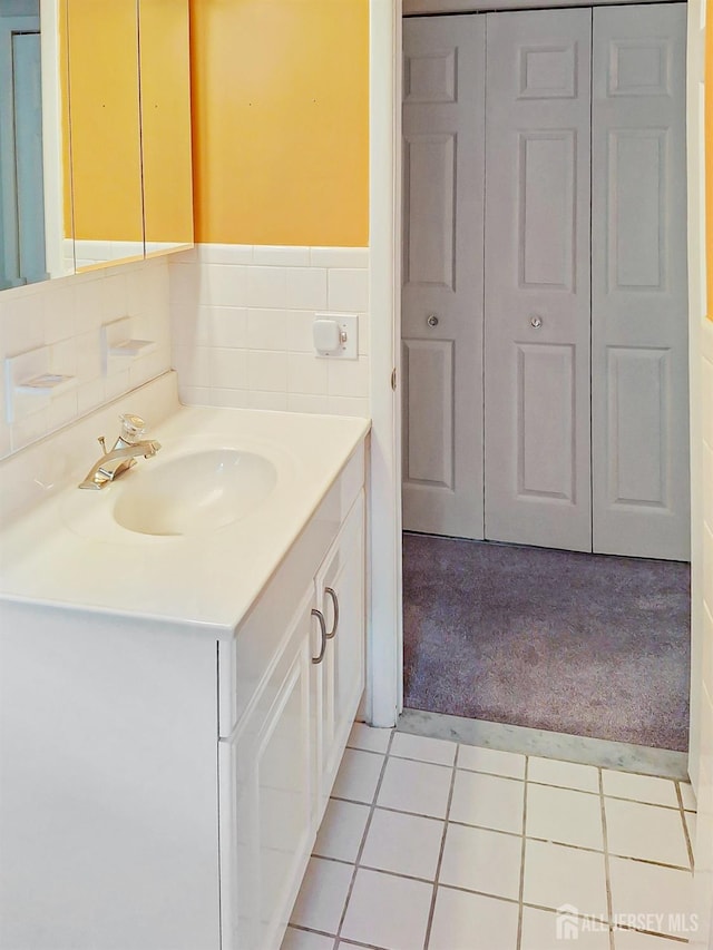 bathroom with tile patterned flooring and vanity