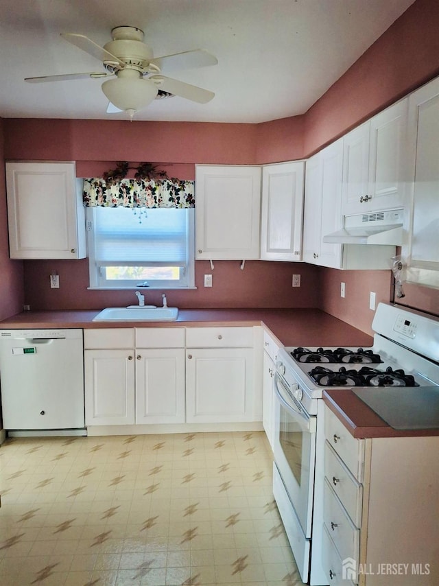 kitchen featuring white cabinets, white appliances, ceiling fan, and sink