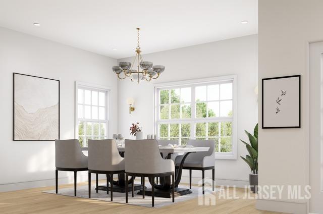 dining area featuring a chandelier and light wood-type flooring