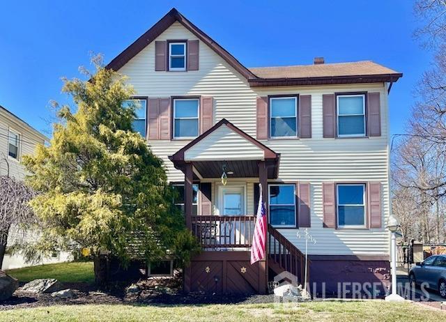 townhome / multi-family property featuring a porch