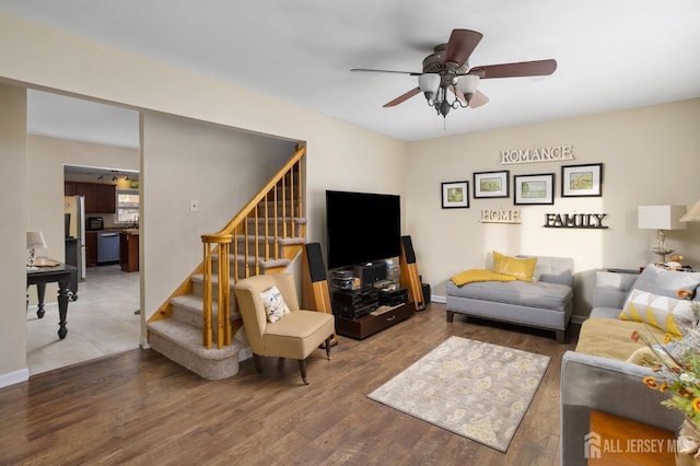 living room with hardwood / wood-style floors and ceiling fan