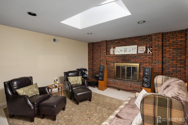 living room featuring a brick fireplace and carpet