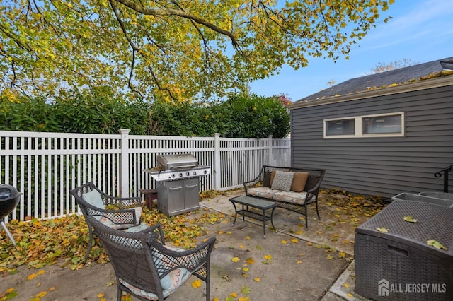 view of patio with a grill