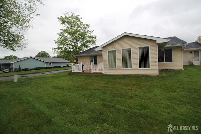 816-C Deal Rd, Monroe, NJ 08831 - rear view of property with a lawn and a deck