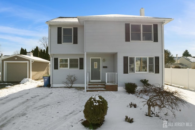 front of property with an outbuilding and a garage