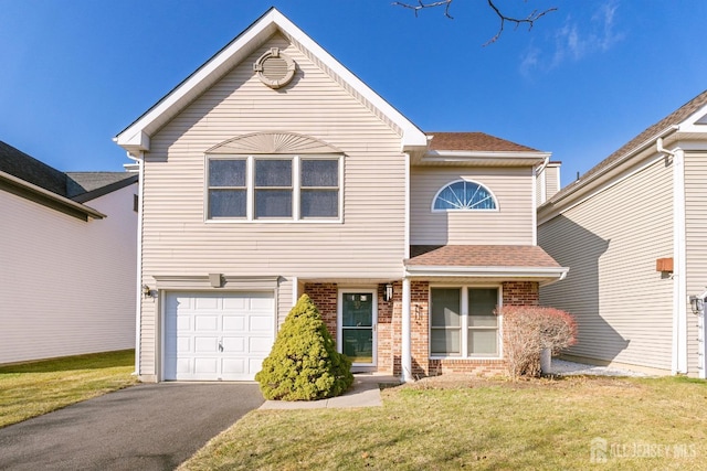 front facade featuring a front yard and a garage