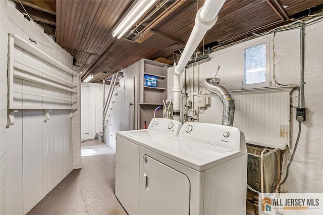 laundry area with washing machine and clothes dryer and laundry area