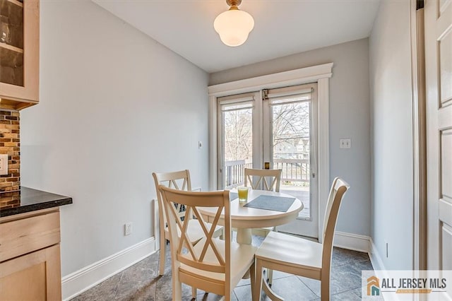 dining room with baseboards