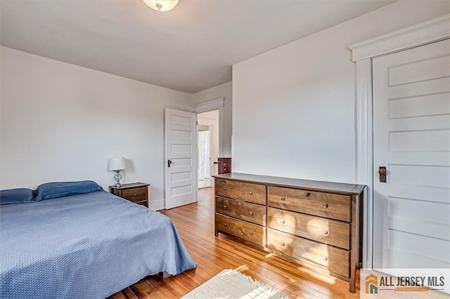 bedroom featuring wood finished floors