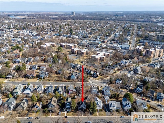 birds eye view of property with a residential view