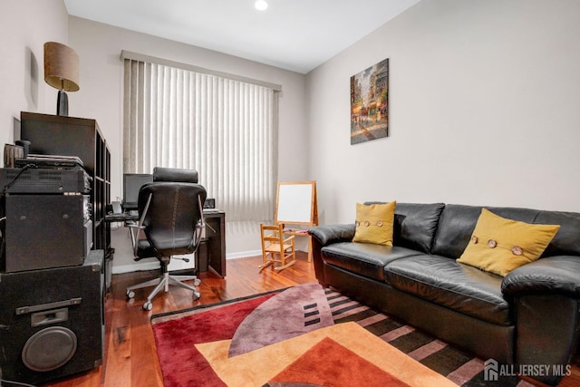 office featuring baseboards and wood finished floors