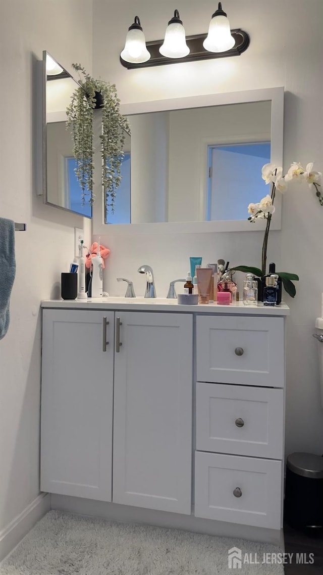 bathroom featuring vanity and baseboards