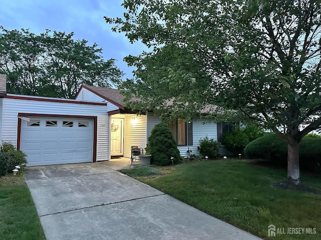 131-C Balsam Plz, Monroe, NJ 08831 - view of front of property with a front yard, an attached garage, and driveway