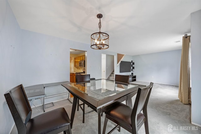 9 Lamberson Ct, Sayreville, NJ 08872 - dining room with stairs, a chandelier, and light colored carpet