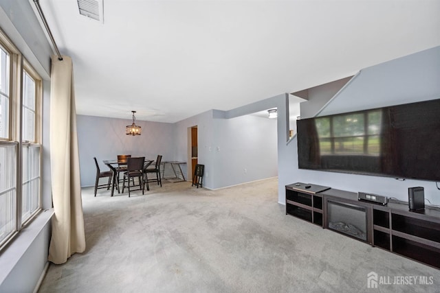 9 Lamberson Ct, Sayreville, NJ 08872 - living area featuring carpet flooring and a chandelier