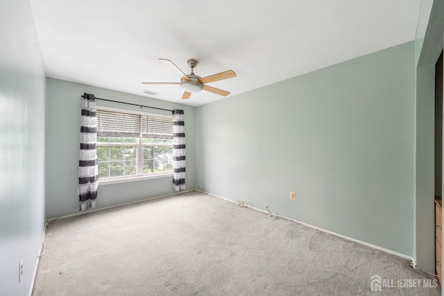 9 Lamberson Ct, Sayreville, NJ 08872 - carpeted empty room with a ceiling fan