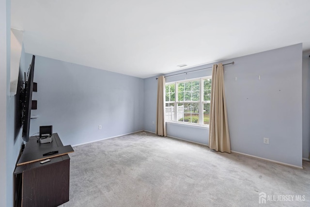 9 Lamberson Ct, Sayreville, NJ 08872 - unfurnished living room featuring carpet flooring and a desk