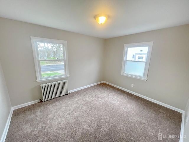 66 W Spring St W, Somerville, NJ 08876 - carpeted spare room with radiator, plenty of natural light, and baseboards